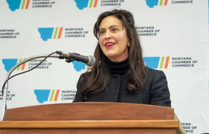 Secretary Christi Jacobsen: 'Montana's new business registrations increased in July 2024' 7 Christi Jacobsen, with long dark hair, smiles as she speaks at a podium in front of a backdrop featuring the Montana Chamber of Commerce logo during Business Days.
