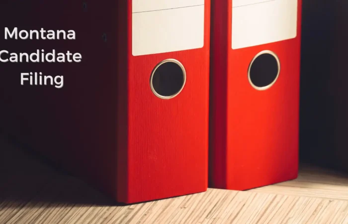 Candidate filings continue to increase over opening weekend 2 Two red file binders stand upright on a wooden surface, with the text Montana Candidate Filing to the left—signaling the start of candidate filings ahead of opening weekend.