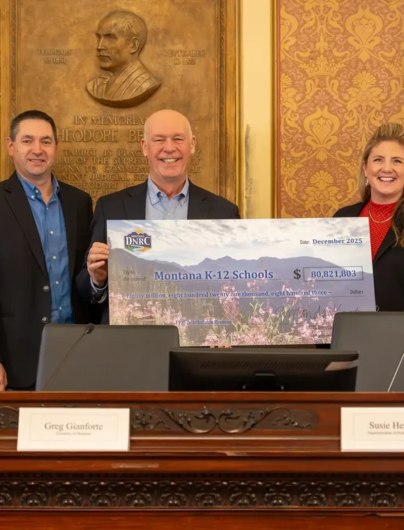 Montana Secretary of State Christi Jacobsen and the Land Board receive a check for fiscal year 2025.