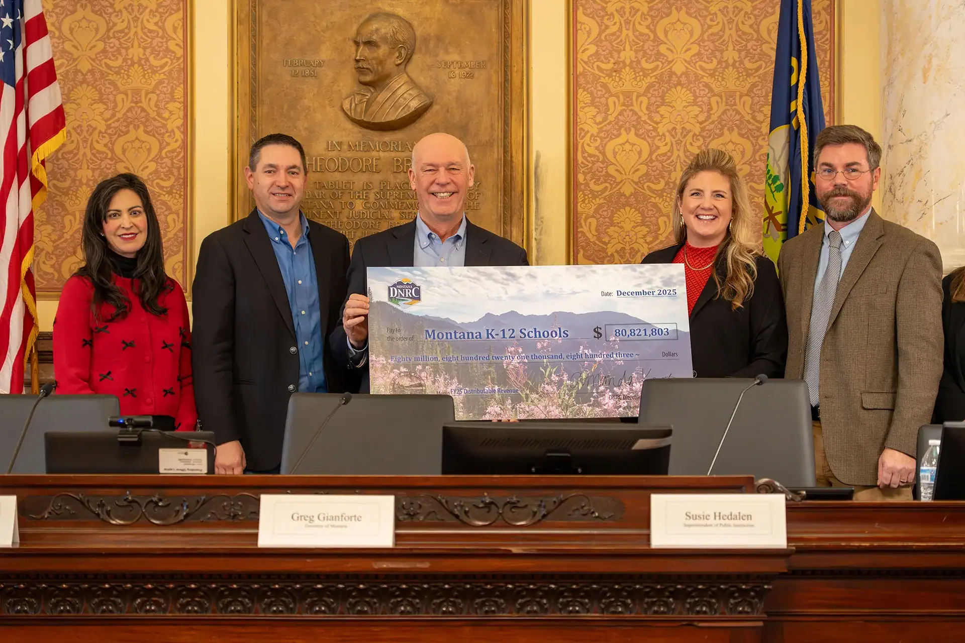 Montana Secretary of State Christi Jacobsen and the Land Board receive a check for fiscal year 2025.
