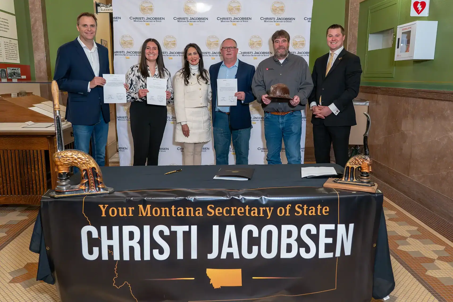 Montana Secretary of State Christi Jacobsen with leaders from the Montana Mining Association.