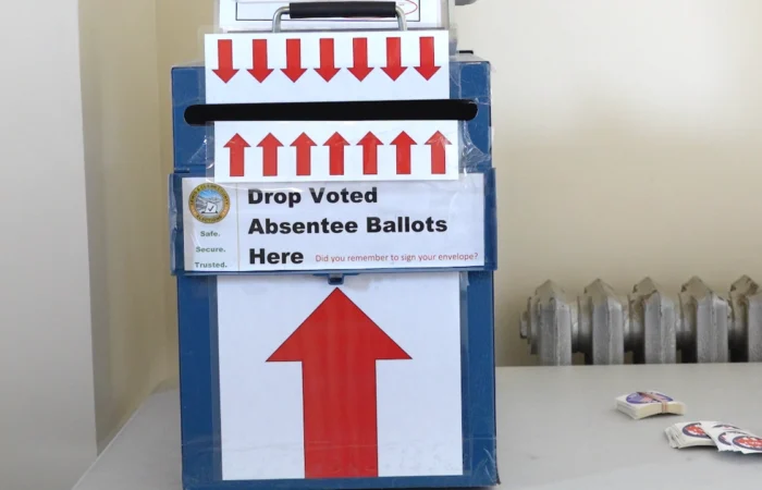 Secretary Christi Jacobsen: ‘Absentee ballots mailed for Montana's 2026 General Election’ 1 A blue Montana absentee ballot drop box with a sign that reads Drop Voted Absentee Ballots Here and a large upward-pointing arrow.