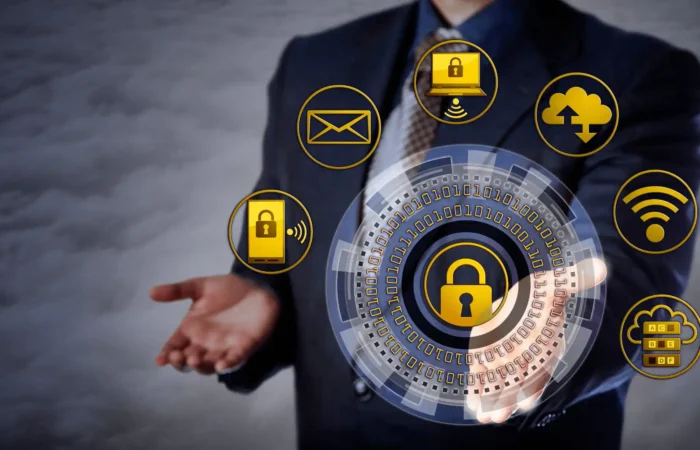 Secretary of State's Office reminds Montana businesses to stay safe from cybersecurity threats 8 A businessperson in a suit stands with open hands; digital icons represent cybersecurity threats like locks, cloud storage, email, and Wi-Fi—highlighting how Montana businesses must stay vigilant against evolving digital risks.