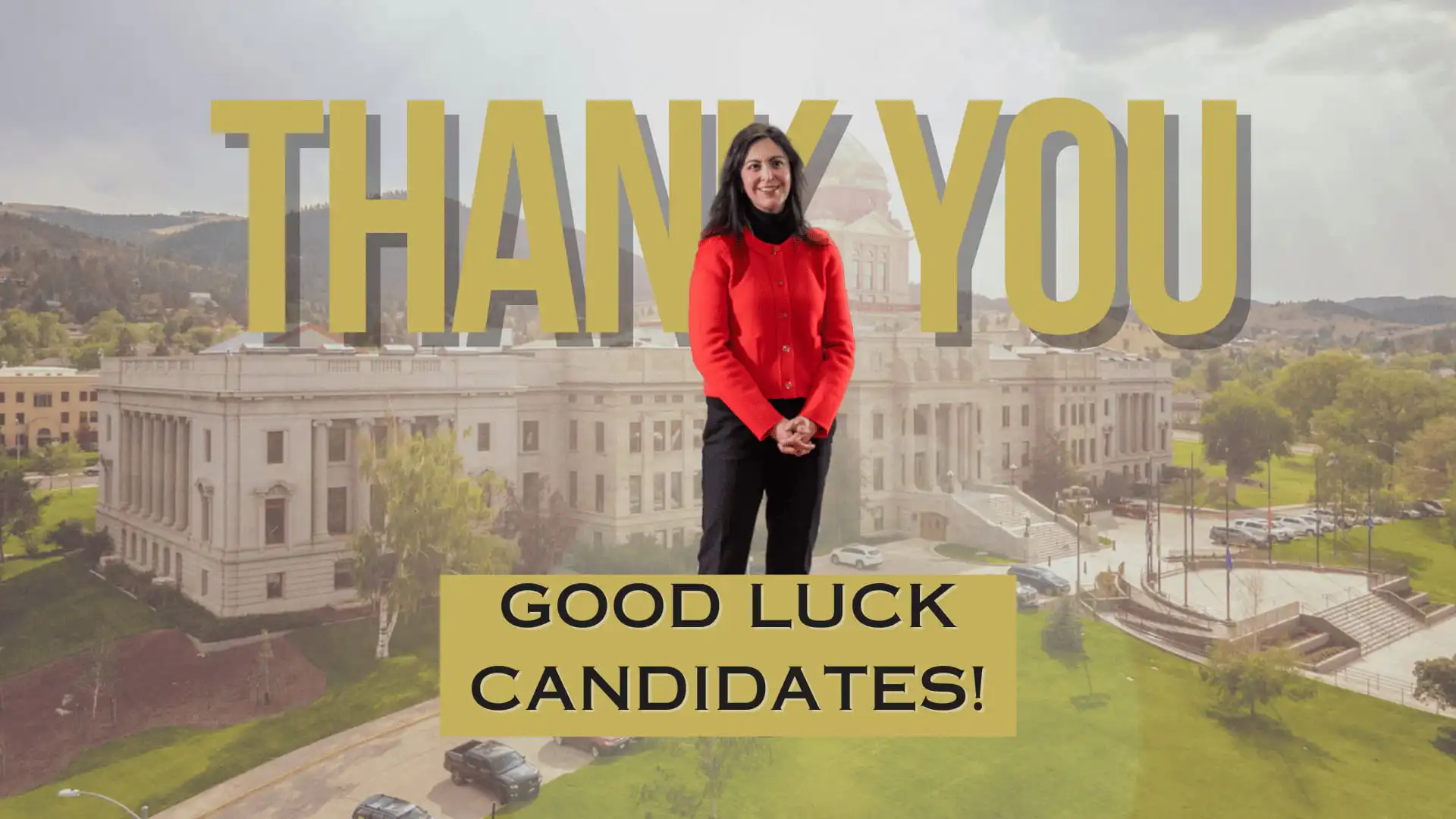 Secretary Christi Jacobsen stands in a red jacket before a government building, with “THANK YOU” above her and a sign below reading “GOOD LUCK CANDIDATES!” marking 2024 candidate filing.