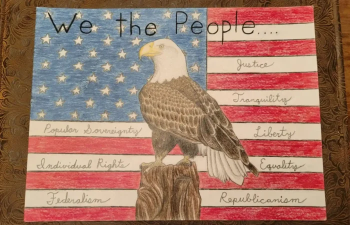 Secretary Christi Jacobsen announces winners of 2022 US Constitution Contest 6 A hand-drawn American flag with a bald eagle perched on a tree stump, inspired by the US Constitution Contest. “We the People...” tops the image, with words like Justice, Liberty, and more—just as seen in 2022 winners celebrated by Christi Jacobsen.