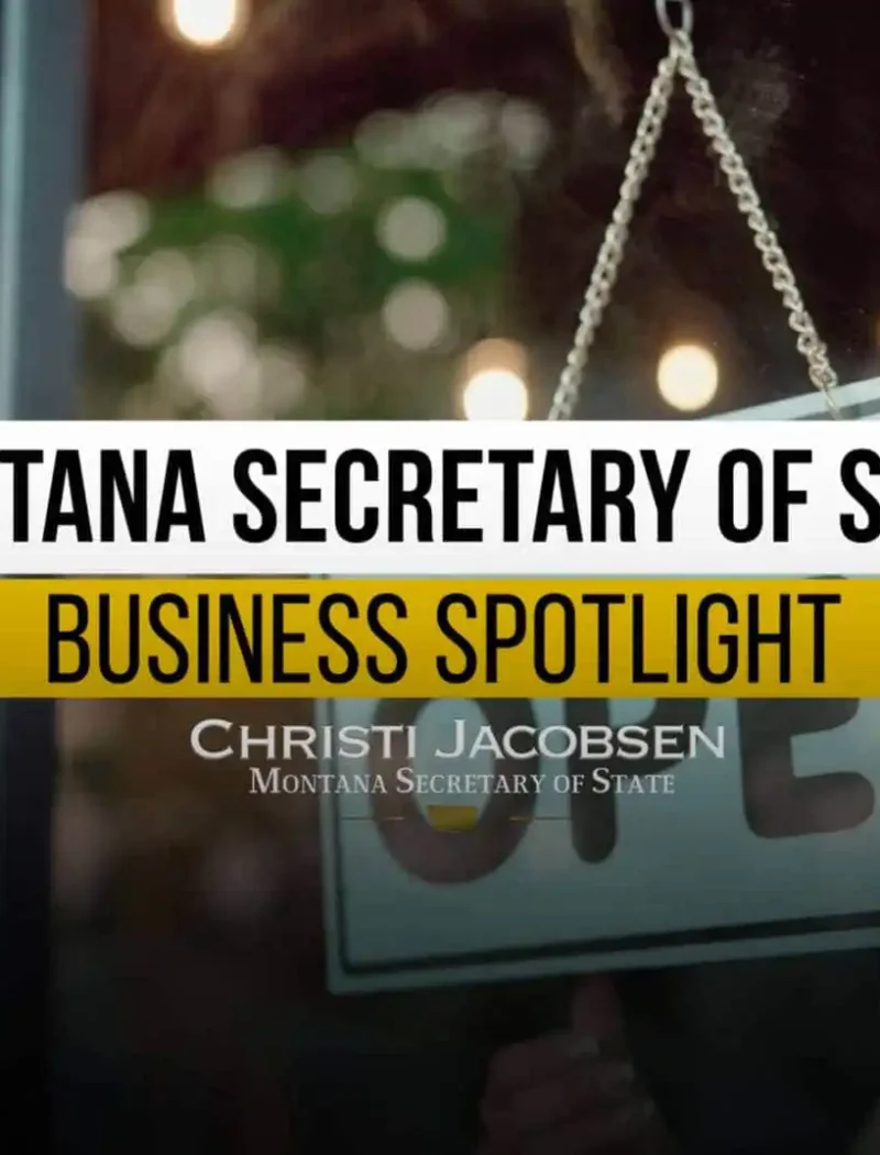 A person holds an Open sign at a storefront. Overlaid text reads: Montana Business Spotlight, highlighting Montana business success. Christi Jacobsen, Secretary of State.