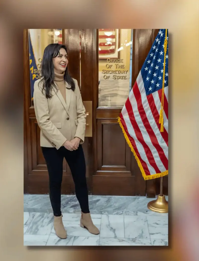 Secretary of State Christi Jacobsen announces new business registrations continued climbing in July 10 A woman stands indoors near an American flag, smiling with her hands clasped. She wears a beige blazer, black pants, and boots. Behind her is a wooden door marked Office of the Secretary of State, where Christi Jacobsen handles business registrations.