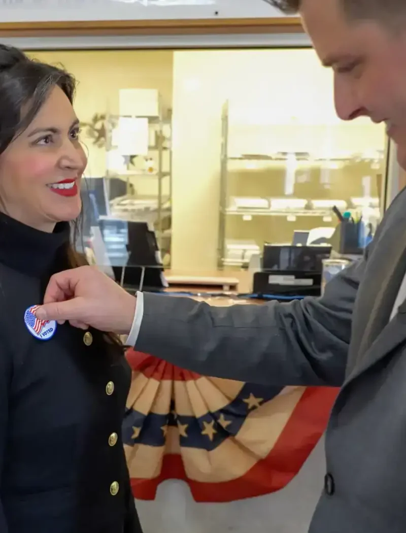 Montana Secretary of State Christi Jacobsen receives her "I Voted" sticker after casting her votes in a Montana election.