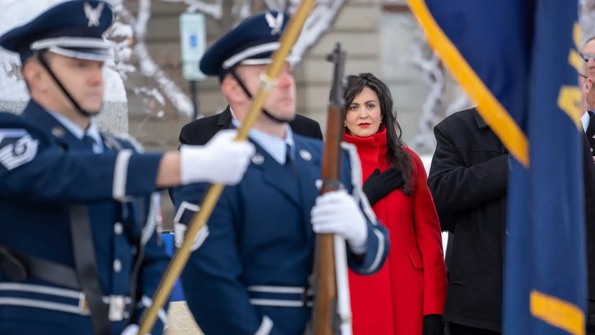 Montana Secretary of State Christi Jacobsen addresses the flags during the national anthem in front of the Montana State Capitol building.