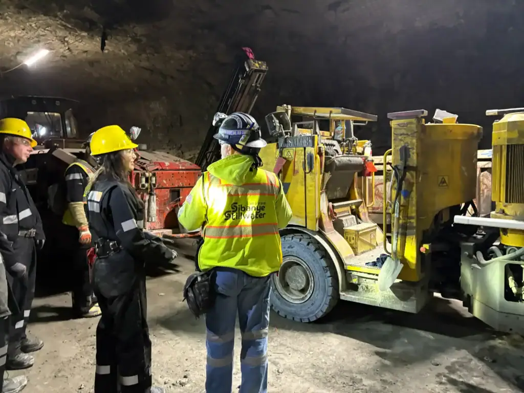 Montana Secretary of State Christi Jacobsen visits with members of the Stillwater Mine team.