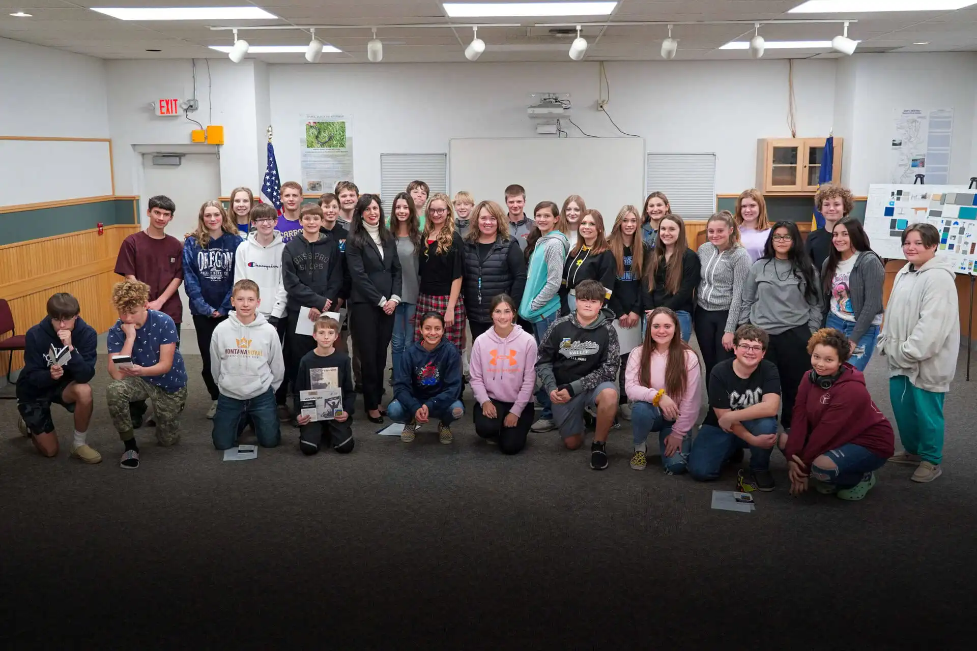 Townsend Middle School recognized for participation in US Constitution Contest 12 A large group of smiling teens and a few adults pose together in a Townsend Middle School classroom, standing and kneeling in rows. The background features a whiteboard, bulletin boards, and US Constitution Contest materials.