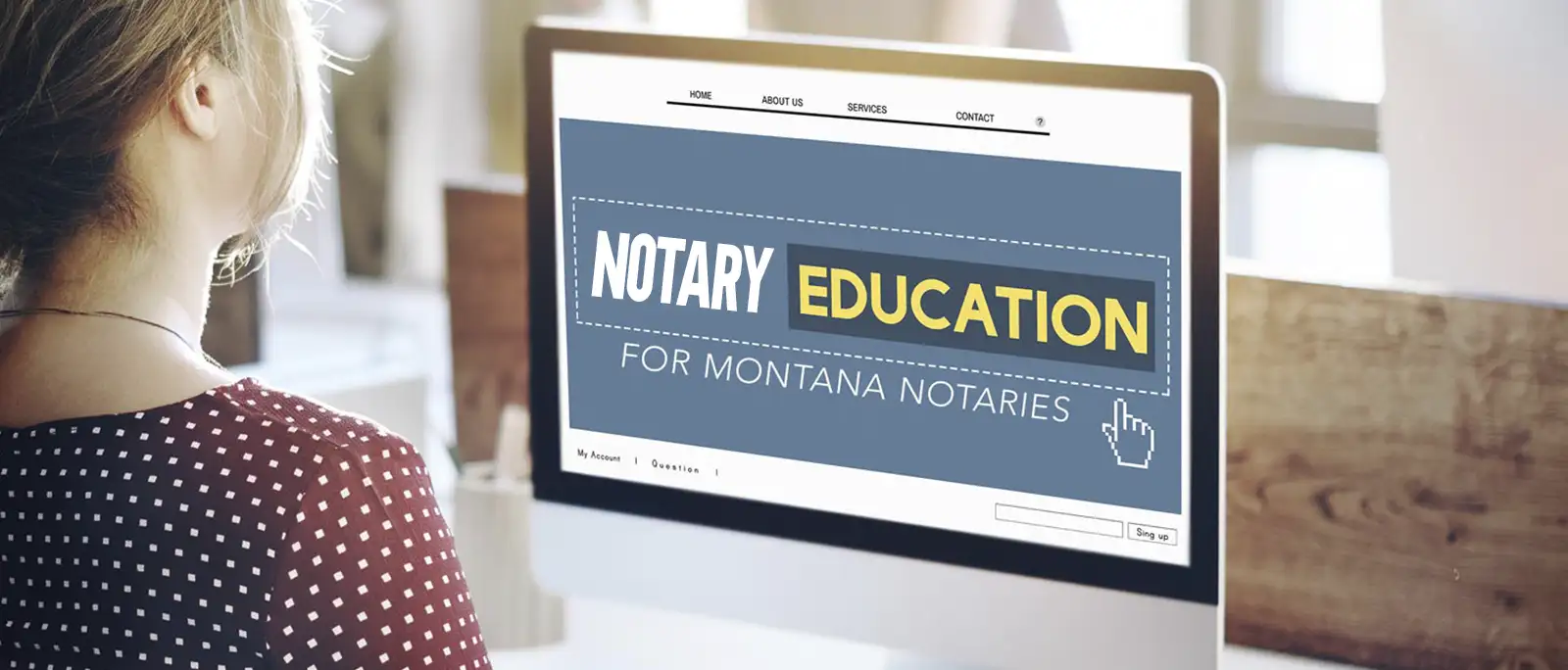 A woman with blonde hair in a ponytail looks at a computer screen displaying a website titled Notary Education for Montana Notaries, featuring a blue and yellow design, as the cursor points to the Notary Training section.