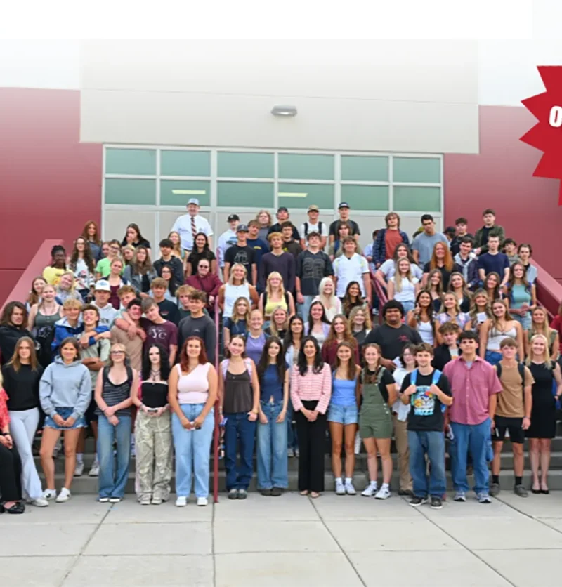 Secretary Christi Jacobsen announces YouthVote 2026 is now open 1 A large group of students and adults stand on school steps smiling. A red banner says, Voting is open October 5th-28th! The building is red and white with large windows, highlighting the excitement around YouthVote and promoting civic engagement among the community.